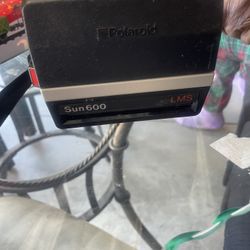 vintage Polaroid Sun 600 LMS instant film camera. 