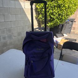 Used Purple Jansport Rolling Backpack
