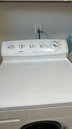 Kenmore, heavy duty, two way tumble, action, stainless steel white washing machine.