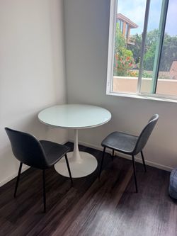 Dining set- 1 glass top, 2 chairs, 1 table.