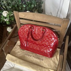 Louis Vuittons Alma GM Monogram Vernis Leather Satchel Bag Red