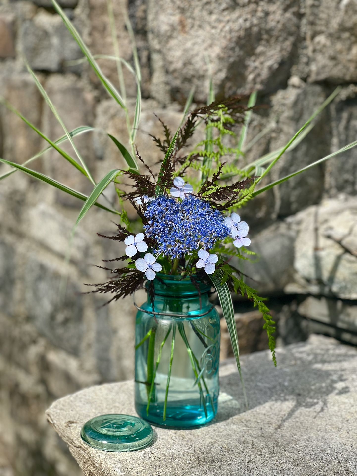 Fresh-cut Flower Arrangement in Antique Ball Mason Jar
