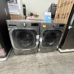 LG NEW WASHER AND GAS DRYER 