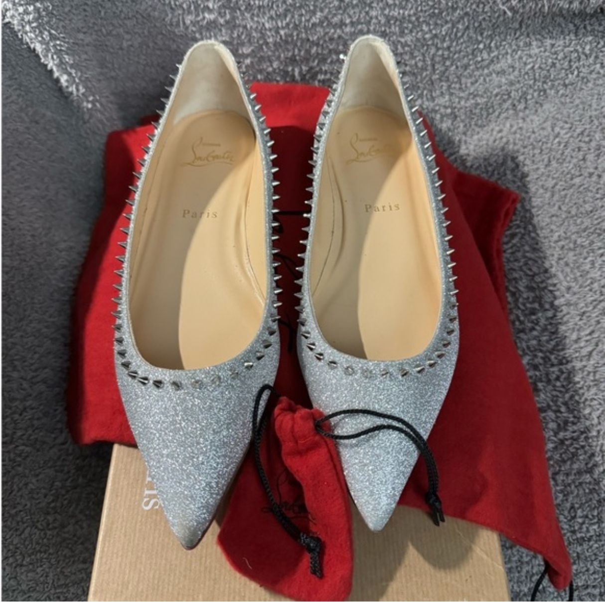Christian Louboutin glitter spiked flats.