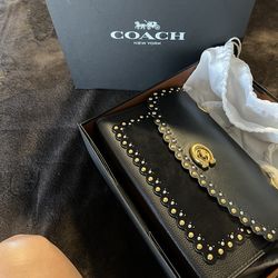 COACH (SCLLP RVT SUDE PRKR) handbag in the color Black Multi.