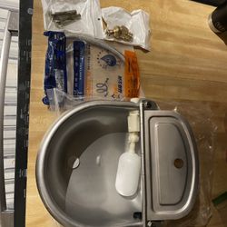 stainless steel automatic water bowl for your pet that mounts on a wall and has a float switch $40 