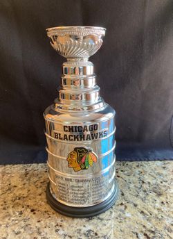 Trophy and pucks in cases