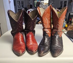 Two pairs of nailed bottom cowboy boots