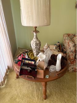 Coffee table that can hold lot of things. Free lamp with it. Great condition