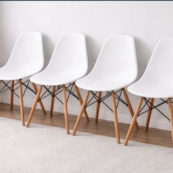 4 modern white molded plastic chairs
