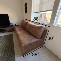 Remington Leather armless sofa.