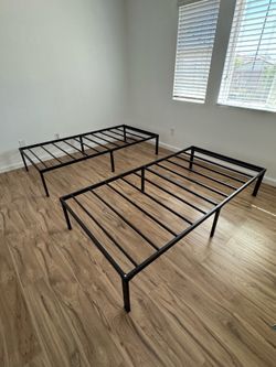 Two basic twin bed frames