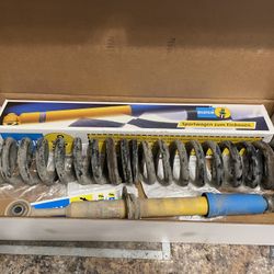 Bilstein shock absorber ( yellow/blue part) 	 A coil spring 