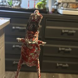 A crafted dinosaur recycled, Coca-Cola pieces