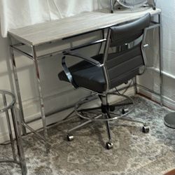 Narrow tall desk (good for posture) with built in extra plugs and desk chair