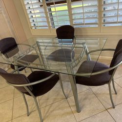 Glass Table With Four Chairs And Two Barstools.