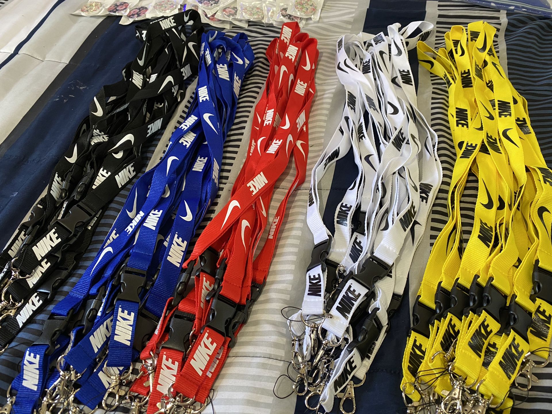 Nike lanyards & pop sockets