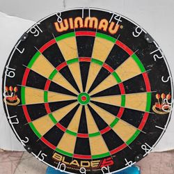 The Winmau Blade 5 Dual Core bristle dartboard is an advanced tournament-grade dartboard designed to minimize bounce-outs and maximize scoring potenti