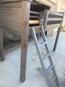 wooden loft bed / elevated bunk bed frame with a built-in ladder