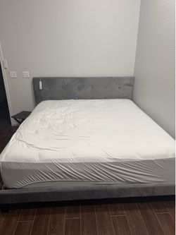 King size bed frame and mattress.