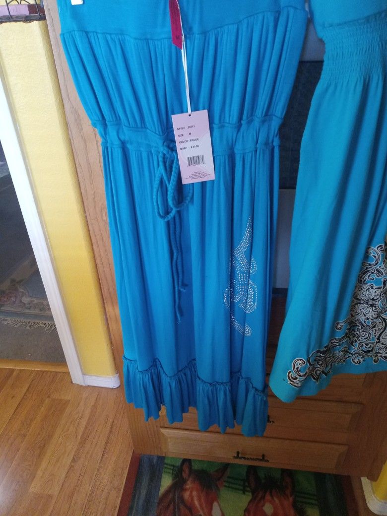 Christina Love Turquoise Dress,with draw string In the middle for a fitted look ,has small silver studs at the lower left side .Very pretty dress .