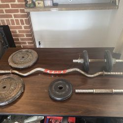 70 Lbs of Free Weights, Curling Bar And 2 Dumbbells With Clamps