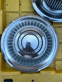 1(contact info removed) This appears to be a vintage Chrysler "dog dish" hubcap,