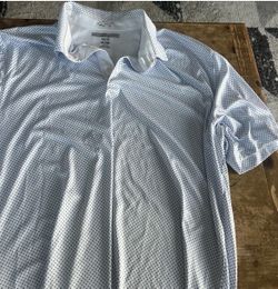 Greg Norman blue golf shirt