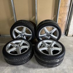 set of 4 Mercedes Benz AMG package rims with tires.