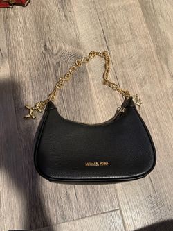 Black shoulder bag with gold charms