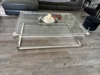 4 piece glass tables with metal and lucite legs. $400 obo
