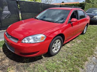 2012 Chevy Impala LS  4 dr Red exterior grey interior .