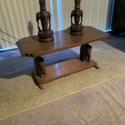 Antique coffee table, hand carved elephant, and foot stand