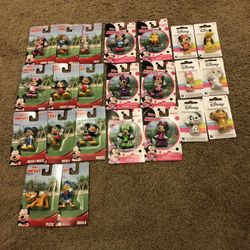 23 Different Disney Mini Figures.