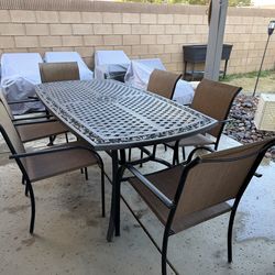 Metal patio table with chairs