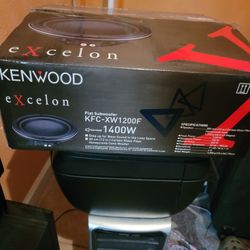 Kenwood eXcelon KFC-XW1200F 12-inch slim subwoofer.