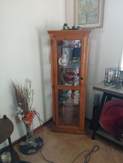 Four tier glass cabinet oak