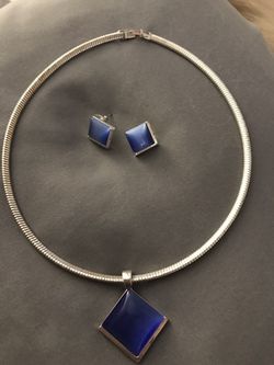 Silver necklace with beautiful blue sapphire slider and matching earrings.