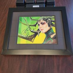 framed, autographed photo of Cate Blanchett as the character Hela from the Marvel film Thor: Ragnarok. 