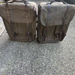 Two Filson Hard Sided Roller Bags. 24” x 17”w x 10.5” h