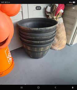 Whiskey barrel planters several available
