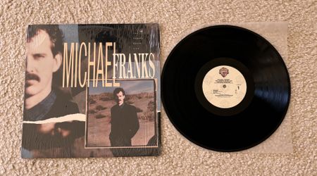 Michael Franks “The Camera Never Lies” Vinyl Lp in Shrink 1987 Warner Records Allied Pressing Like New Copy Jazz Rock. 