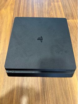 PS4 Slim with Two Controllers and 7 Games