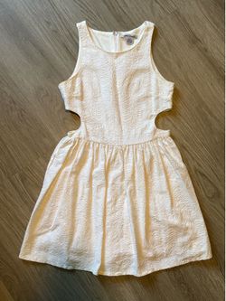 Short embroidered white dress with open slits on side