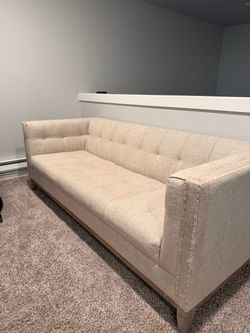 Beige Tufted Sofa with Nailhead Trim