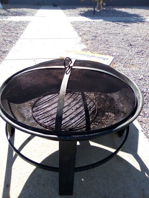 Used Fire Pit With 6 Duraflame Logs 