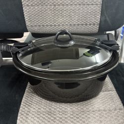 ONLY THE POT AND COVER  black oval slow cooker, likely a Crock-Pot model designed for portability, such as the 6-quart or 7-quart "Cook & Carry" 