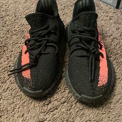 the Adidas Yeezy Boost 350 V2 in the 'Core Black Red' colorway