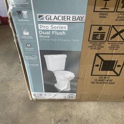 Glacier Bay 12 in. Rough in 2-Piece 1.0 GPF/1.28 GPF Dual Flush Round Toilet in White, Seat Included
