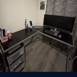 Grey L Shaped Computer Desk With A Glass Top